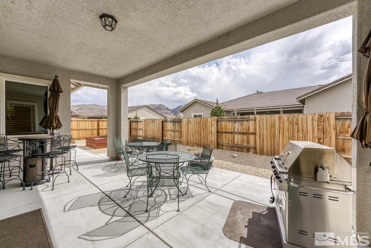 9950 Bernborough Drive Reno, NV 89521 - Photo 18 of 29 a view of a dining room with furniture window and outside view
