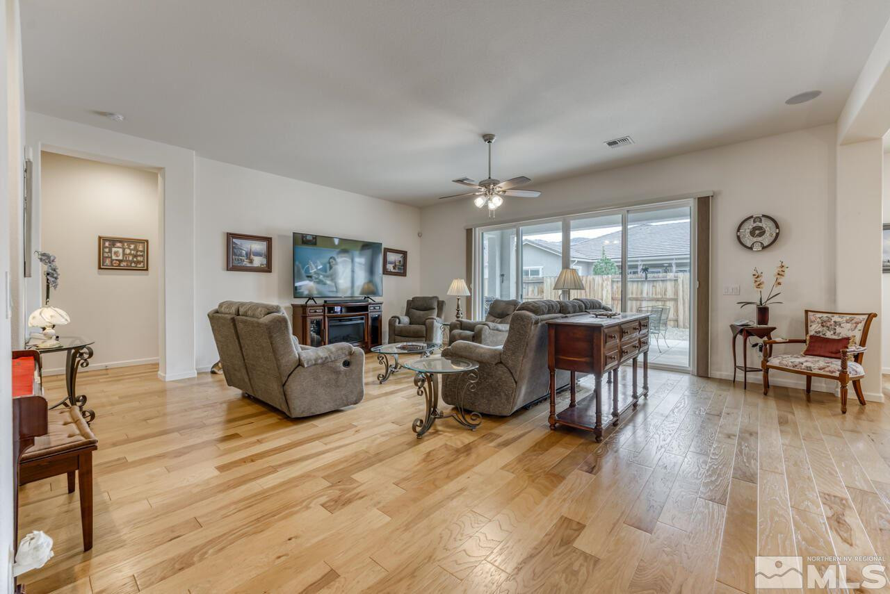 9950 Bernborough Drive Reno, NV 89521 - Photo 3 of 29 a living room with furniture and wooden floor