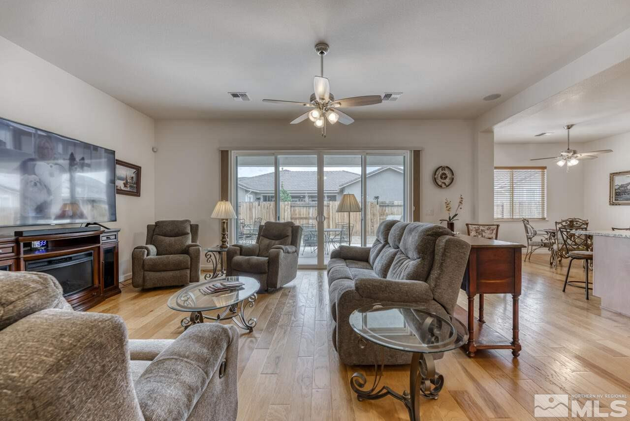 9950 Bernborough Drive Reno, NV 89521 - Photo 4 of 29 a living room with furniture ceiling fan and a large window