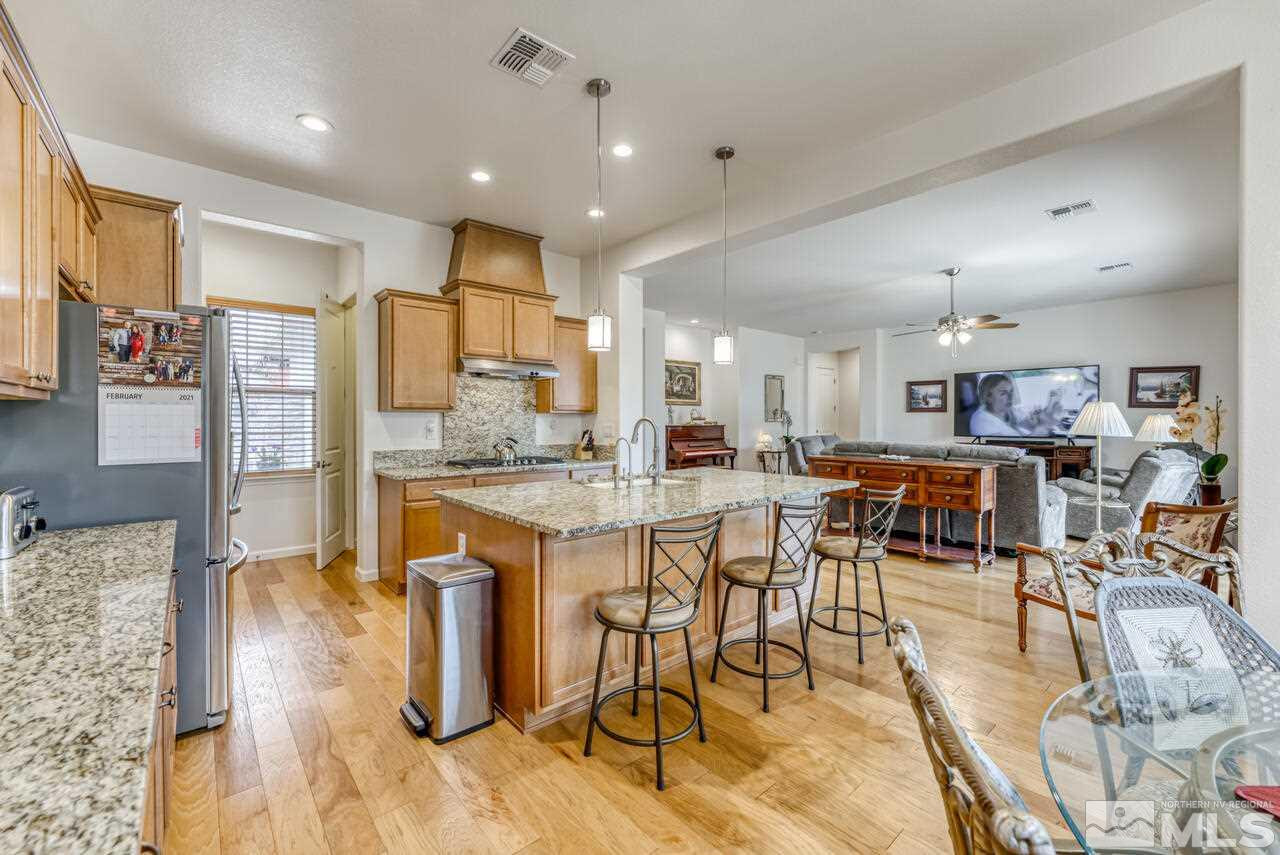 9950 Bernborough Drive Reno, NV 89521 - Photo 7 of 29 a large kitchen with lots of counter space and furniture
