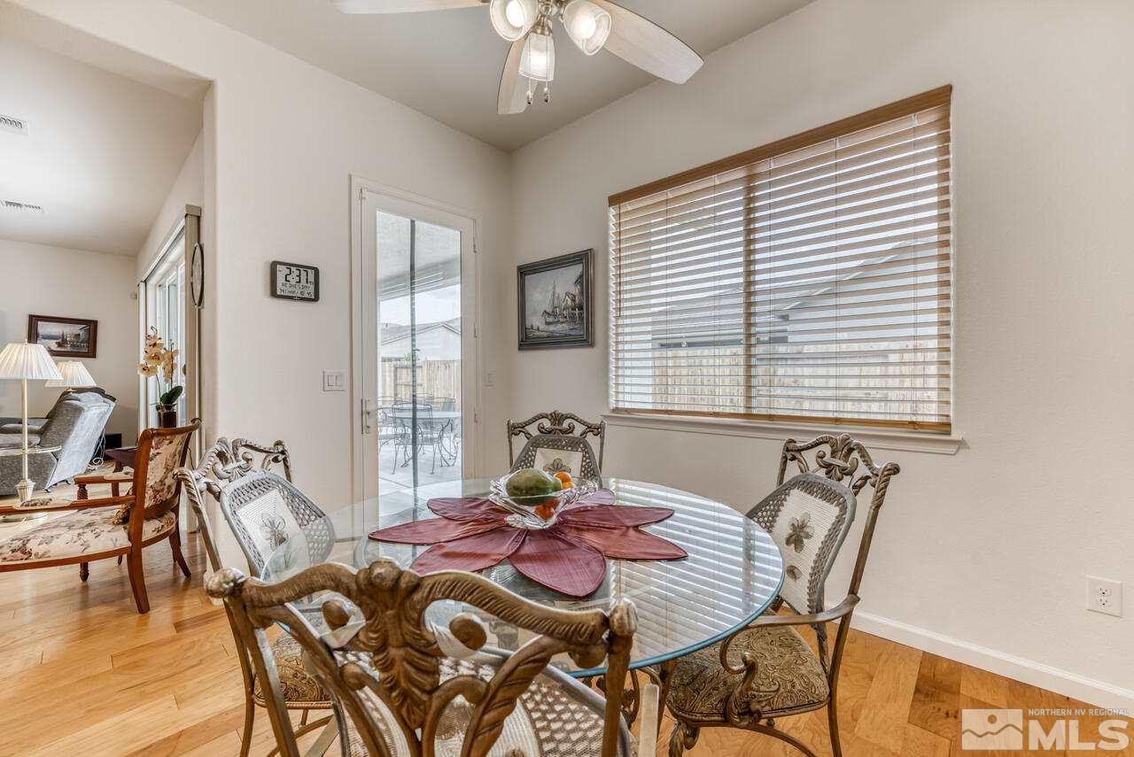 9950 Bernborough Drive Reno, NV 89521 - Photo 8 of 29 a view of a dining room with furniture and wooden floor