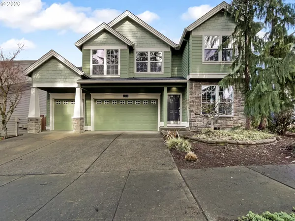 a front view of a house with garage