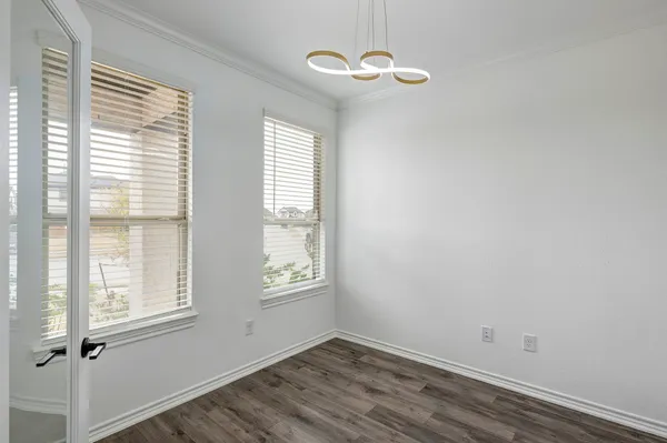 a view of empty room with windows