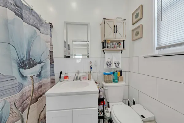 a front view of a house with a yard outdoor seating and garage