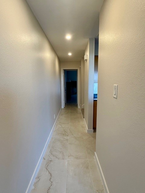 1501 Barton Springs Road, Unit 231 Austin, TX 78704 - Photo 15 of 23 Hallway to primary bedroom and stairs to the other bedrooms.
