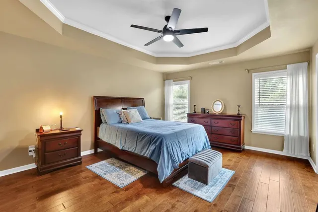 a bedroom with a large bed and a window