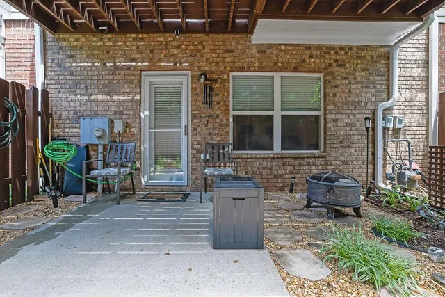 a front view of a house with outdoor seating