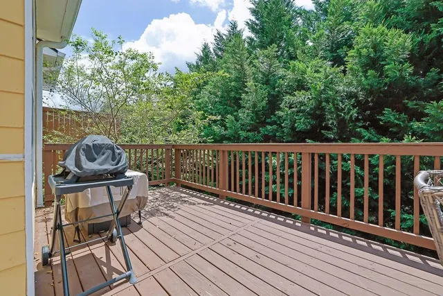 a view of a chairs on wooden deck
