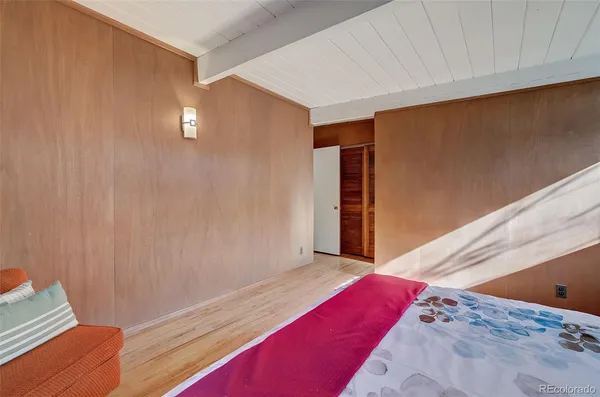 a view of a room with wooden floor and windows