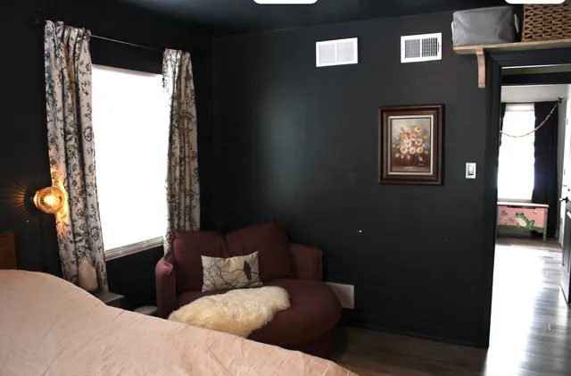 a living room with furniture and a window