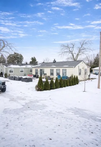 a view of houses with a yard