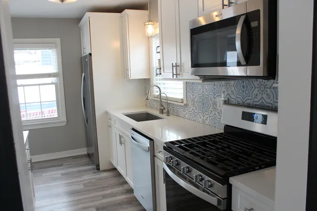 a kitchen with a stove and a microwave