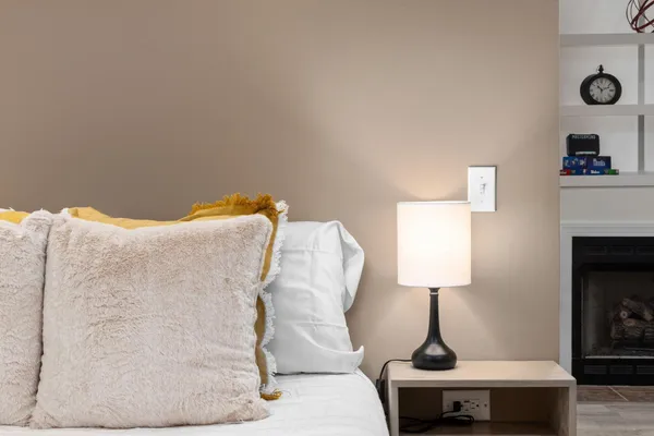 a living room with furniture and a lamp