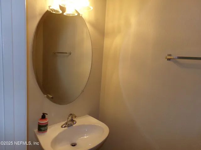 a kitchen with stainless steel appliances a stove sink and microwave