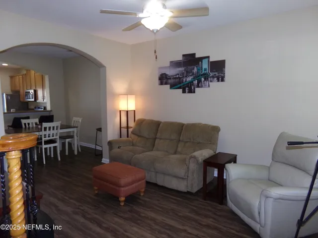 a living room with furniture and a window