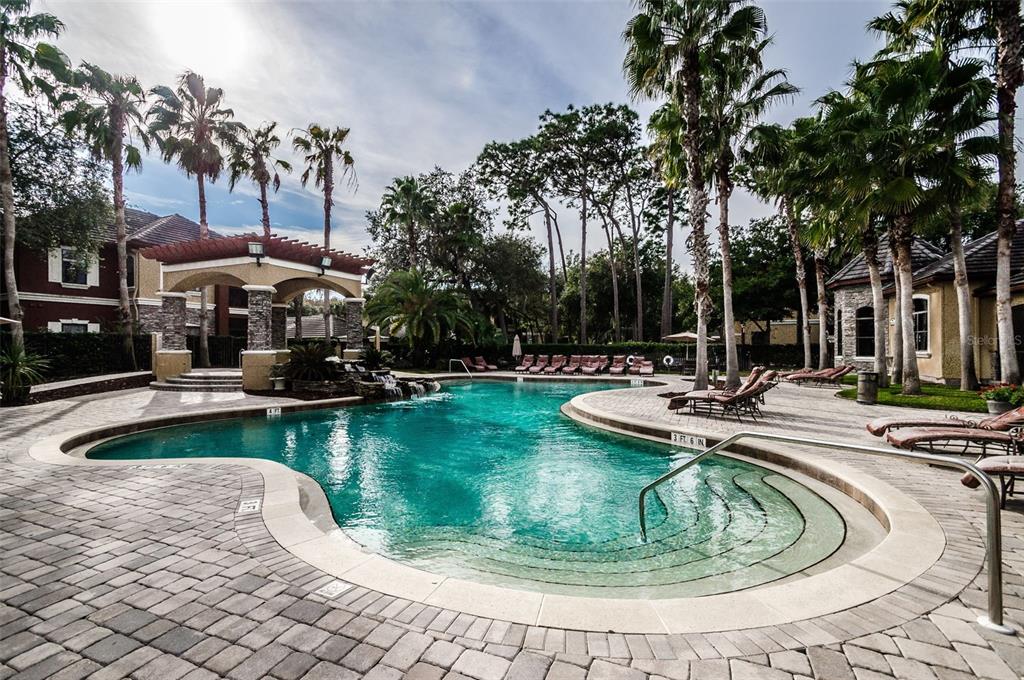 2199 Chianti Place, Unit 918 Palm Harbor, FL 34683 - Photo 19 of 23 a view of a swimming pool with a patio