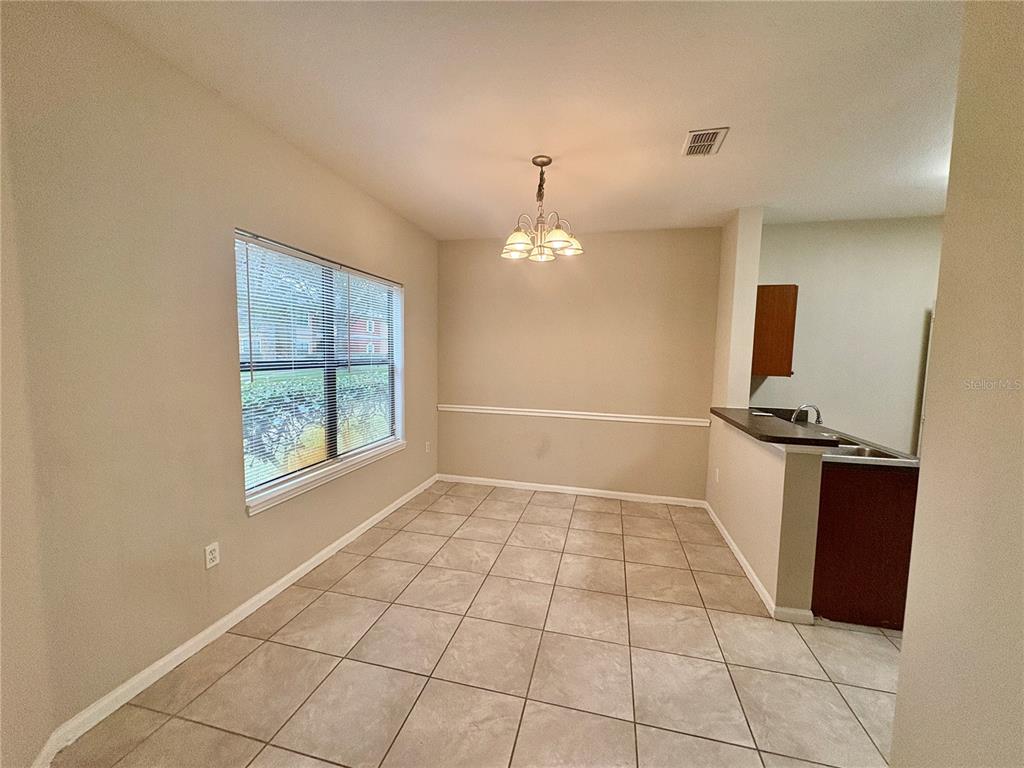 2199 Chianti Place, Unit 918 Palm Harbor, FL 34683 - Photo 4 of 23 a view of an empty room with a window