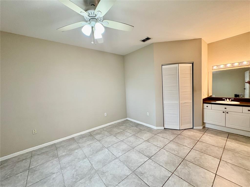 2199 Chianti Place, Unit 918 Palm Harbor, FL 34683 - Photo 6 of 23 a view of a kitchen with a sink and cabinets