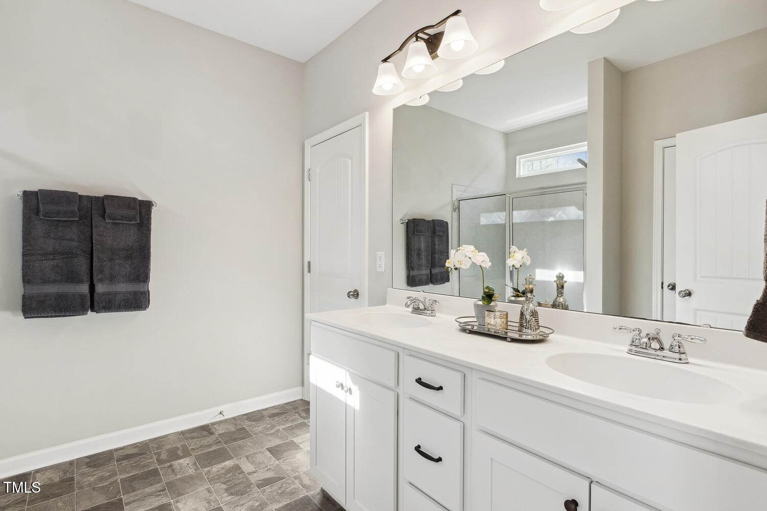 192 Springhill Lane Garner, NC 27529 - Photo 28 of 43 a bathroom with a sink vanity and mirror