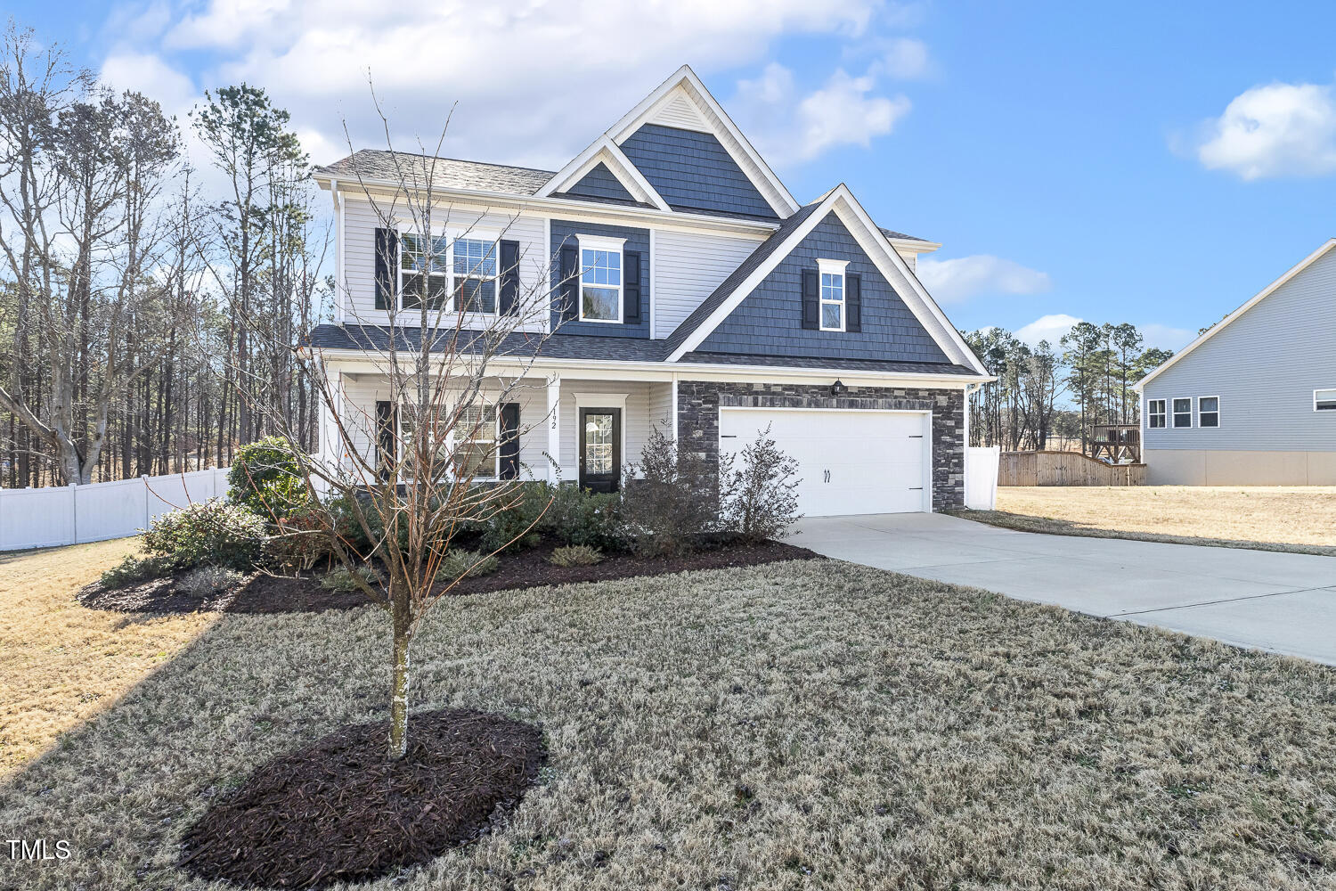 192 Springhill Lane Garner, NC 27529 - Photo 3 of 43 a front view of a house with garden