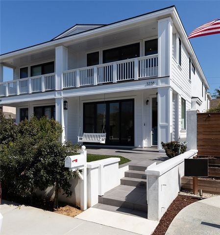 a view of white house with a yard in front of it
