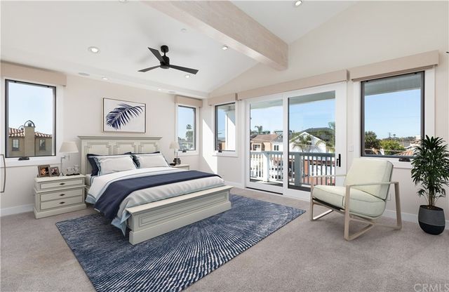 a bedroom with a large bed and a couch