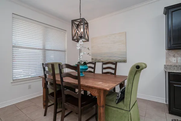 a kitchen with stainless steel appliances granite countertop a stove top oven a sink and dishwasher a refrigerator with wooden cabinets