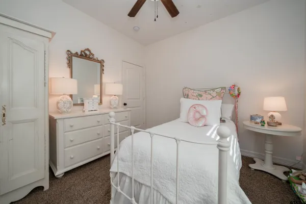 a view of a room that has a couch and a table in it