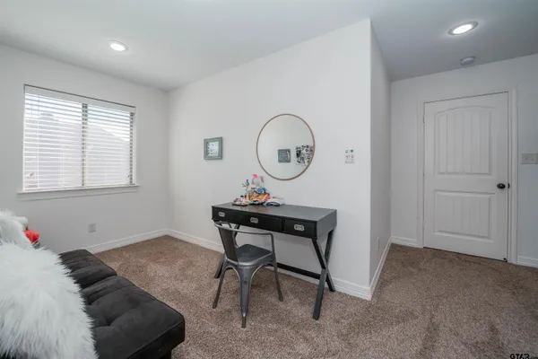 a bedroom with a bed and furniture