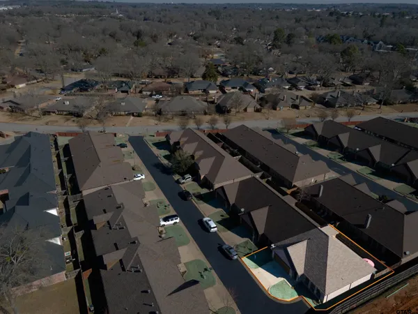 an aerial view of houses with outdoor space