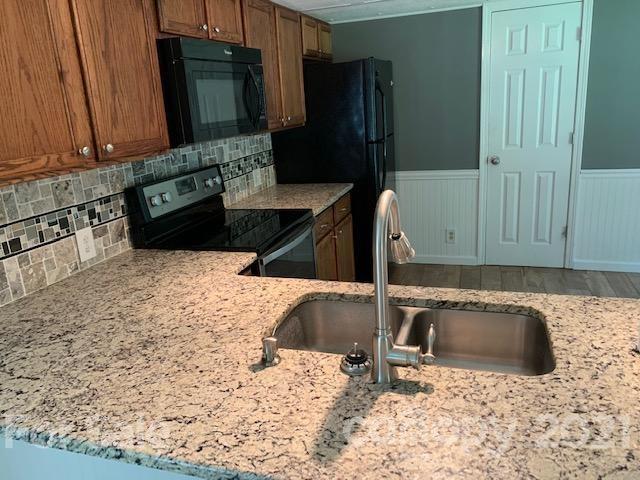 422 Ewaldz Road Blacksburg, SC 29702 - Photo 7 of 15 a kitchen with a sink and a refrigerator