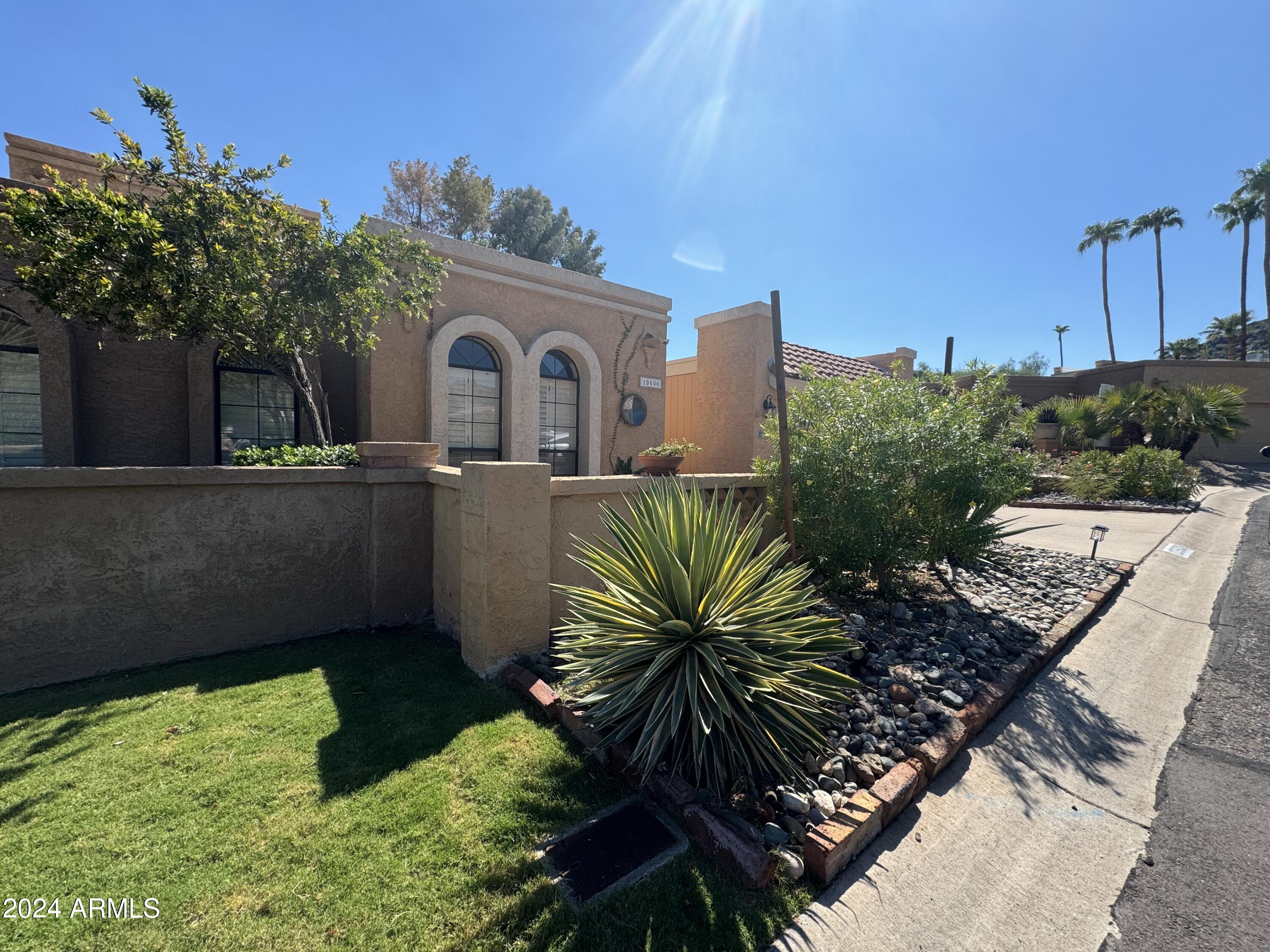 10606 North 8th Street Phoenix, AZ 85020 - Photo 2 of 25 a front view of a house with a yard