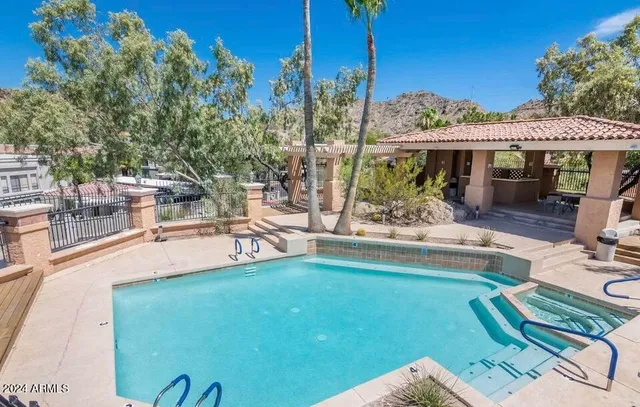 a view of a swimming pool with a patio