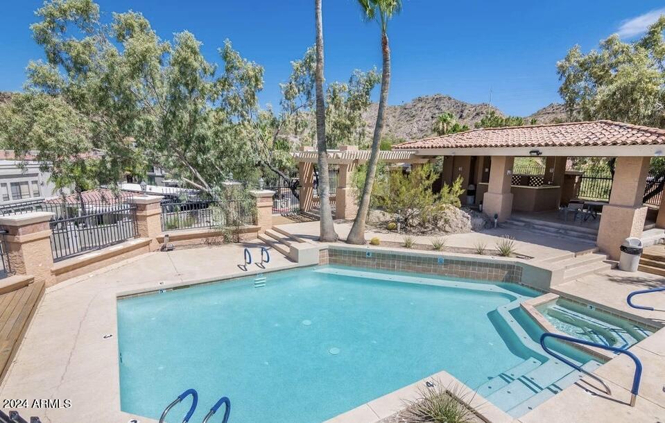 10606 North 8th Street Phoenix, AZ 85020 - Photo 4 of 25 a view of a swimming pool with a patio