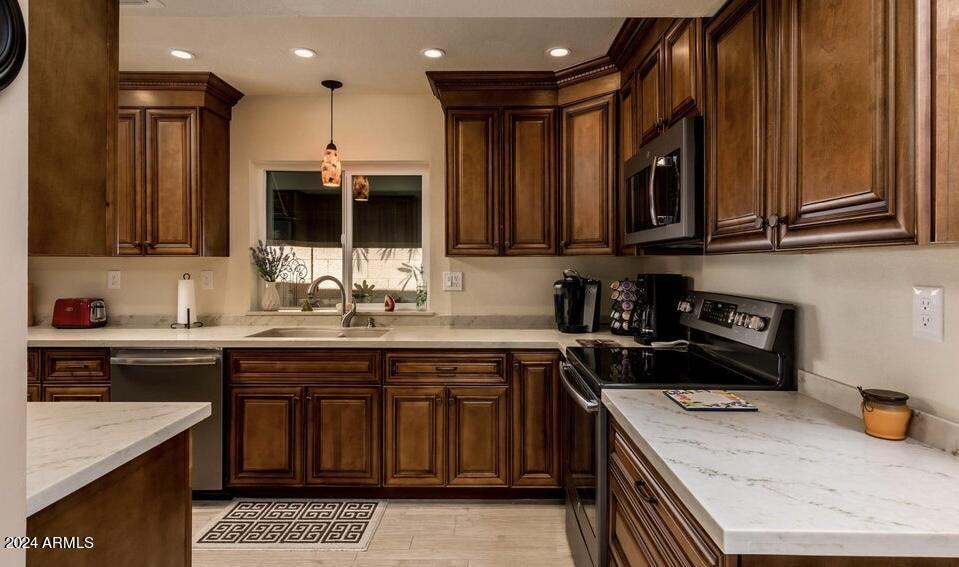 10606 North 8th Street Phoenix, AZ 85020 - Photo 8 of 25 a kitchen with a sink stove and cabinets