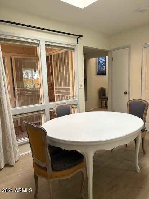 10606 North 8th Street Phoenix, AZ 85020 - Photo 9 of 25 a dining room with a table chairs and kitchen view