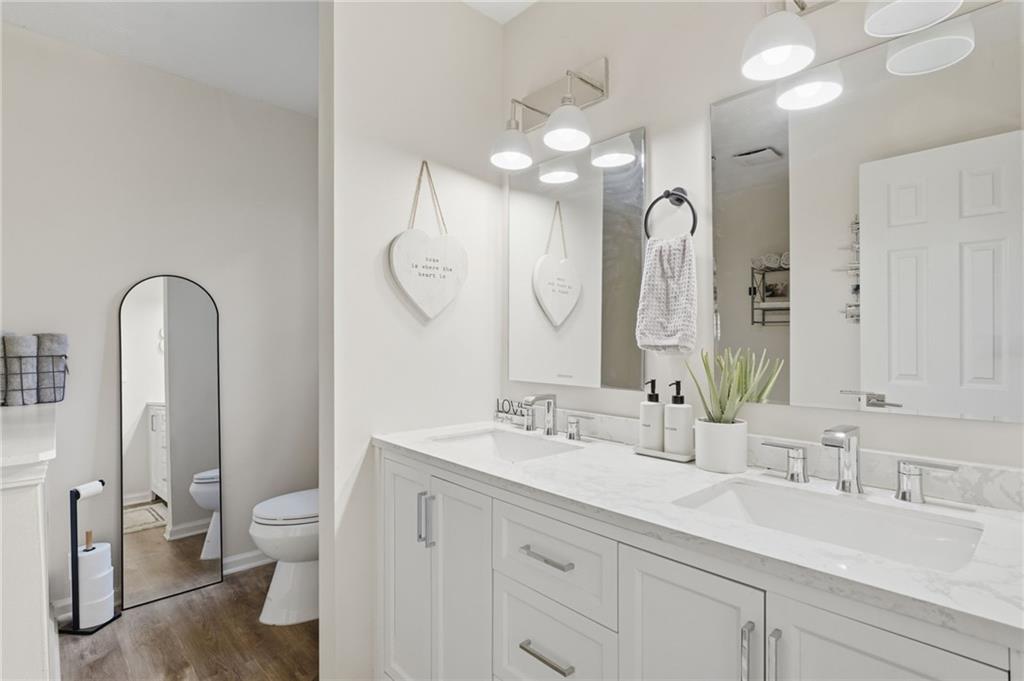 404 Brooks Street Dallas, GA 30157 - Photo 18 of 38 a bathroom with a double vanity sink mirror and toilet