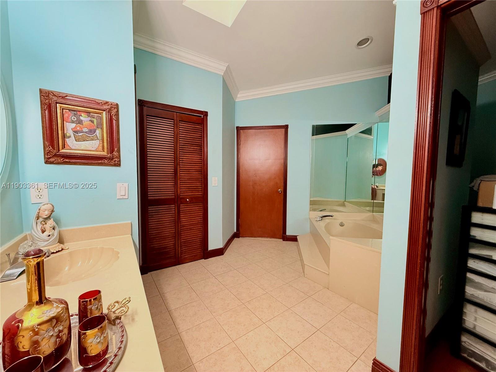 14970 Southwest 46th Terrace Miami, FL 33185 - Photo 12 of 27 a bedroom with a bed and a mirror