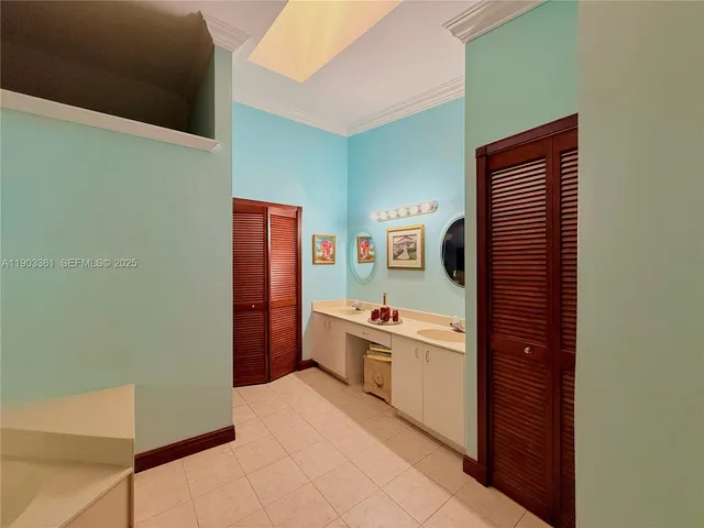 a kitchen with a refrigerator and a stove top oven