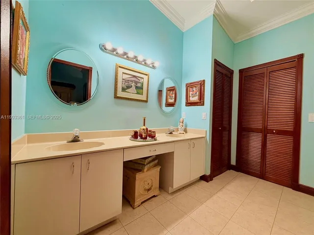 a view of a kitchen with cabinets and wooden floor