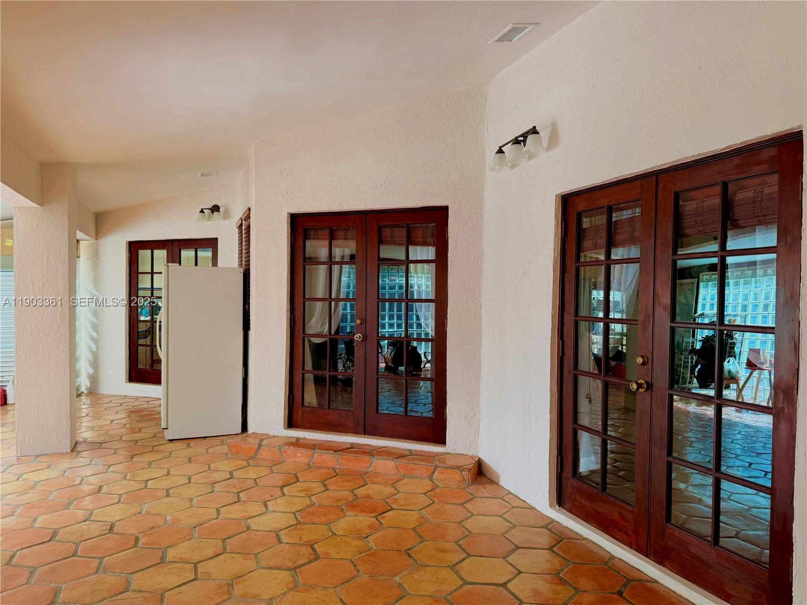 14970 Southwest 46th Terrace Miami, FL 33185 - Photo 16 of 27 a view of an entryway of house