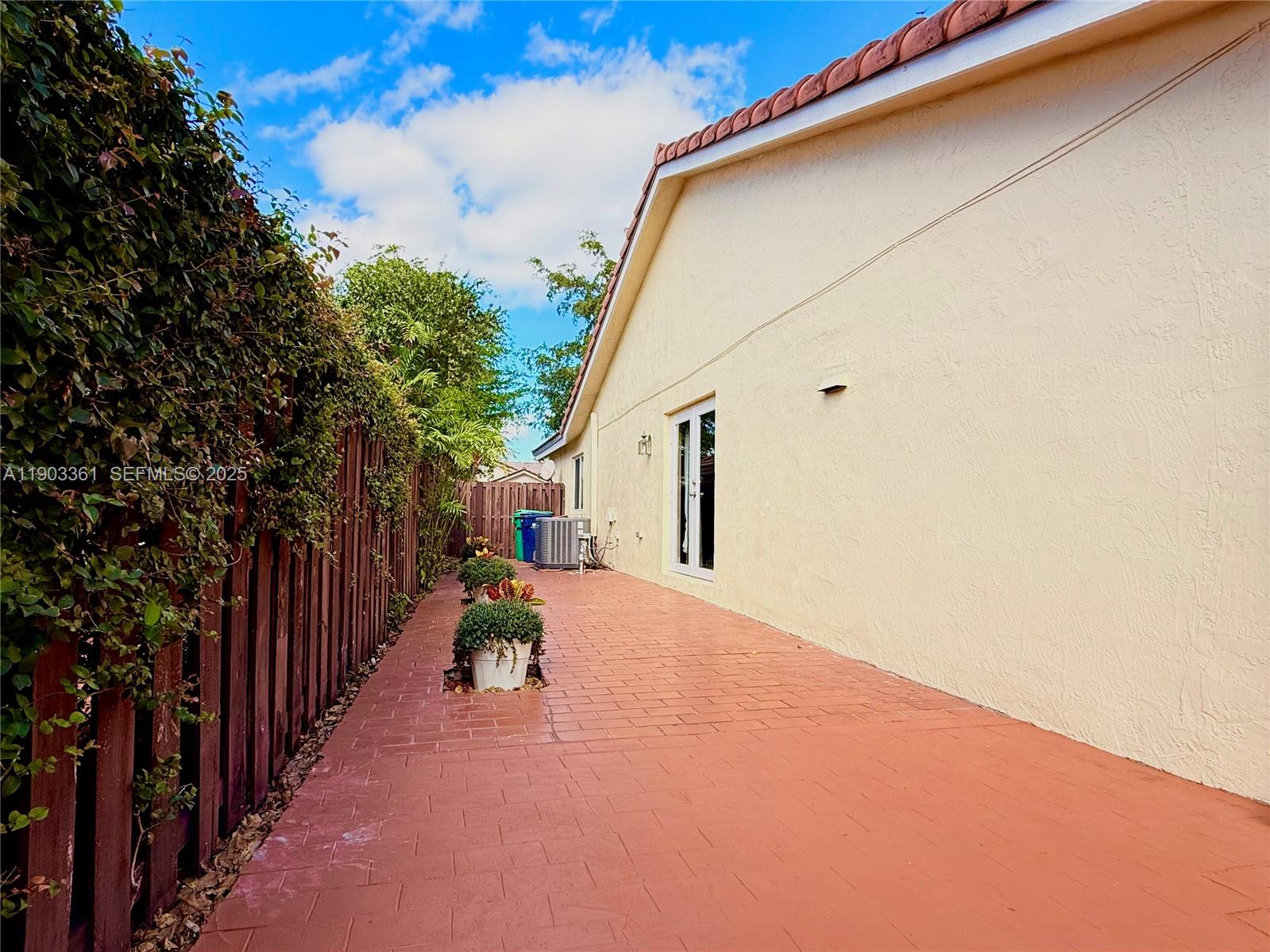 14970 Southwest 46th Terrace Miami, FL 33185 - Photo 24 of 27 a view of a house with a backyard