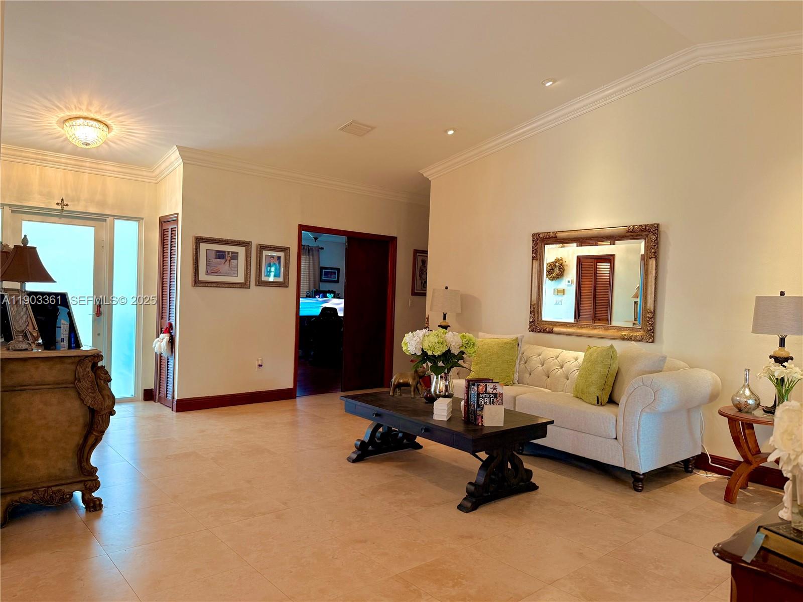 14970 Southwest 46th Terrace Miami, FL 33185 - Photo 3 of 27 a living room with furniture and a flat screen tv