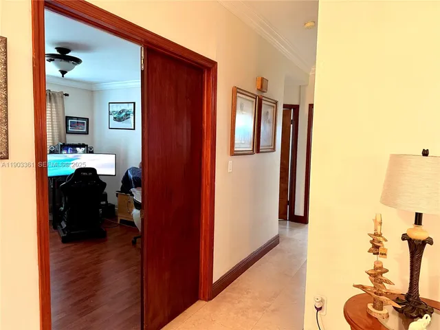 a view of living room with furniture and wooden floor