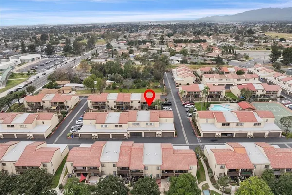 an aerial view of residential houses with outdoor space