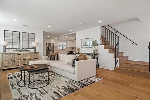 a living room with furniture and a table