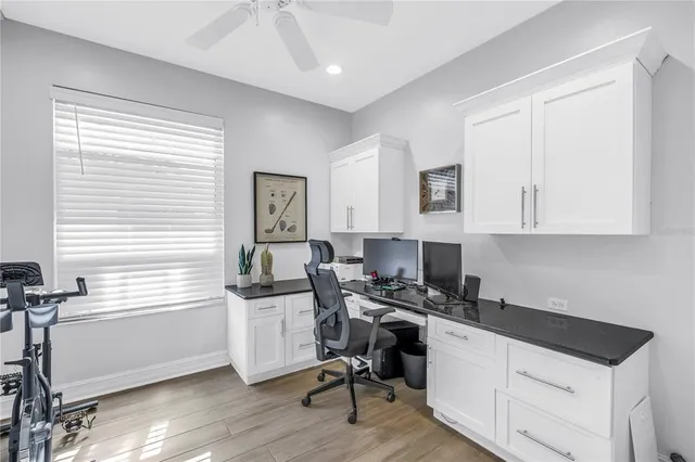 a green field with lots of flowers in it