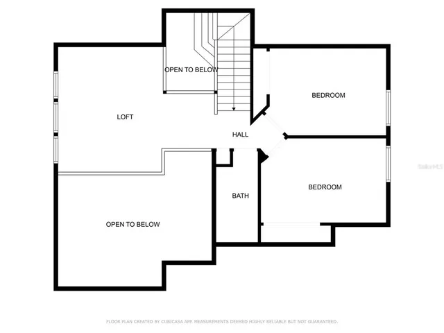 a living room with furniture a rug and a flat screen tv