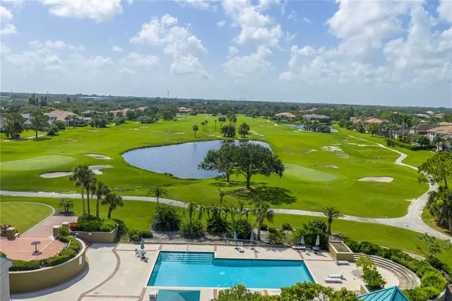a kitchen with refrigerator and cabinets
