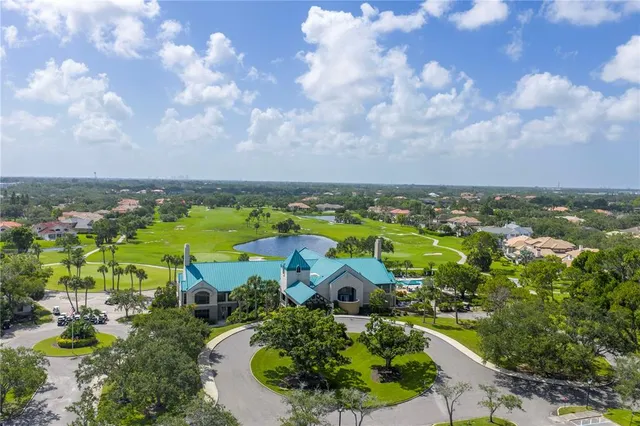a kitchen with granite countertop a sink stove and cabinets